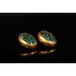 A pair of turquoise and gold ear clips by Gurhan, of oval form in 24ct yellow gold settings,
