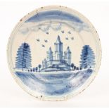 An early 19th Century Dutch blue and white plate, decorated a roundel of a garden,
