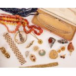 A large quantity of costume jewellery to include a lion brooch by Grosse,