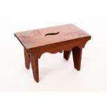 An Arts & Crafts oak stool, 40.