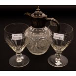 A pair of wine glasses with thumb pressed decorated bowls on knopped stems and circular bases,