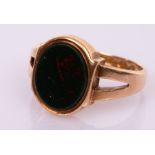 A gentleman's Edwardian bloodstone signet ring, set in 15ct rose gold,
