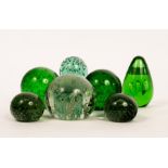 A clear glass dump with tear drop and bubbles, 10cm high, a pair of dark green glass dumps,