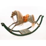An early 19th Century bow rocker rocking horse with flying gallop posture,