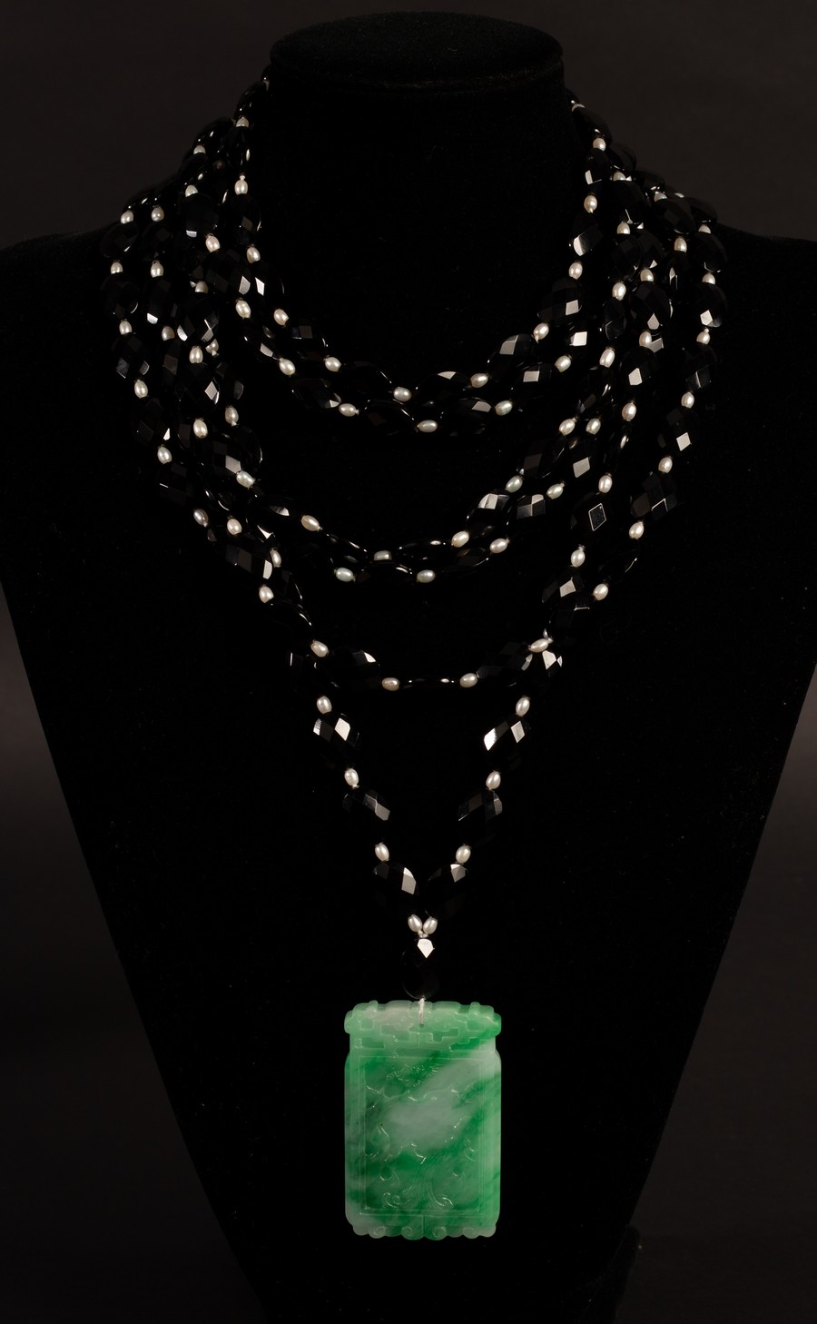 Catherine Prevost, a six-row necklace of faceted black beads with freshwater pearl spacers,