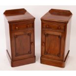 A pair of mahogany bedside tables, each fitted a drawer above a cupboard,