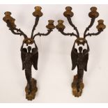 A pair of Empire bronze and ormolu mounted four-branch wall lights,
