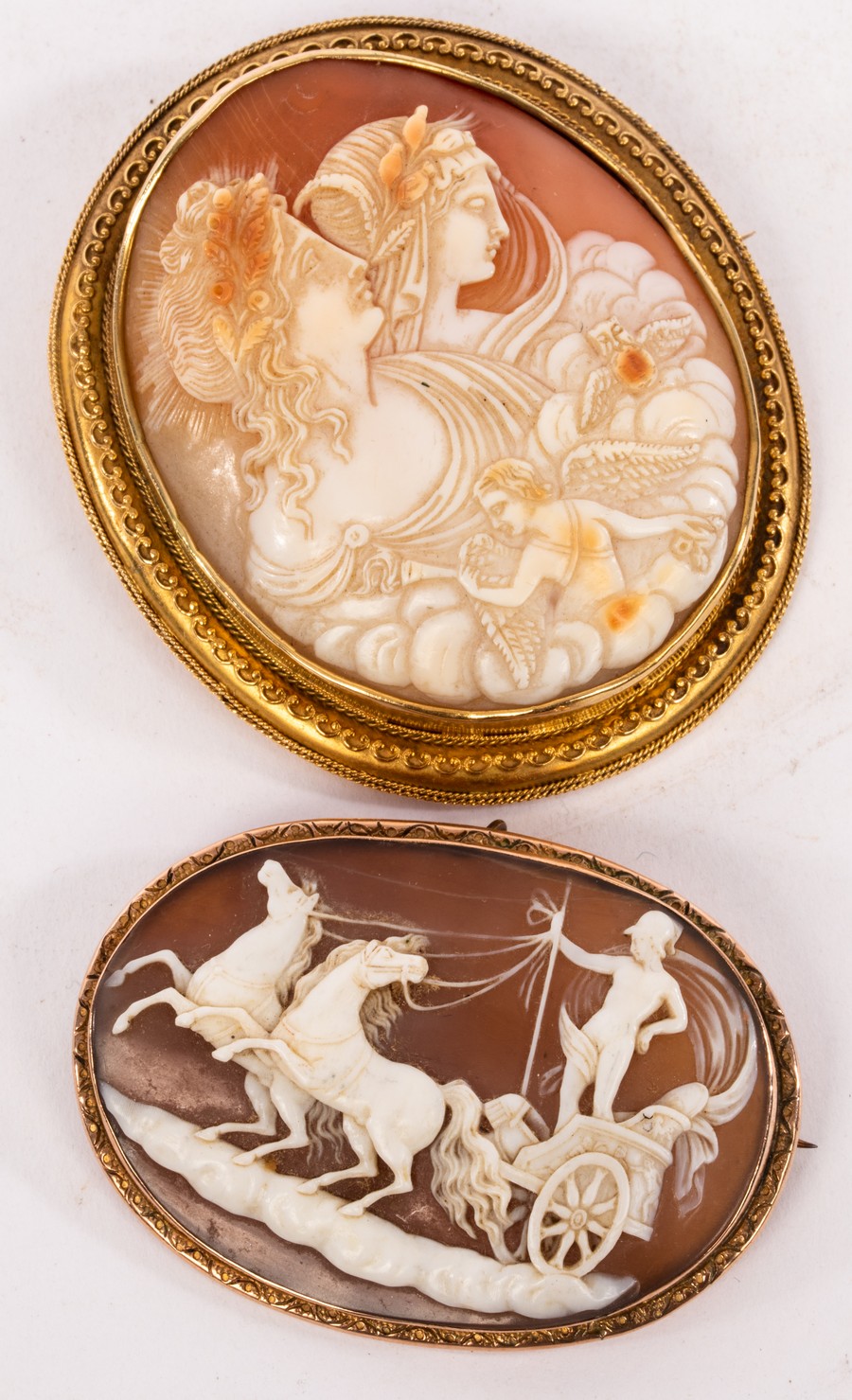 A large 19th Century shell cameo brooch, depicting an allegory of day and night (Eos and Selene),