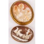 A large 19th Century shell cameo brooch, depicting an allegory of day and night (Eos and Selene),