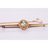 An Edwardian aquamarine and seed pearl bar brooch, set in 15ct gold,
