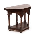 A mid 17th Century oak credence table on bold column supports,
