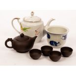 A Yixing Zisha tea set, including a tea pot with a dragon handle and four tea cups,