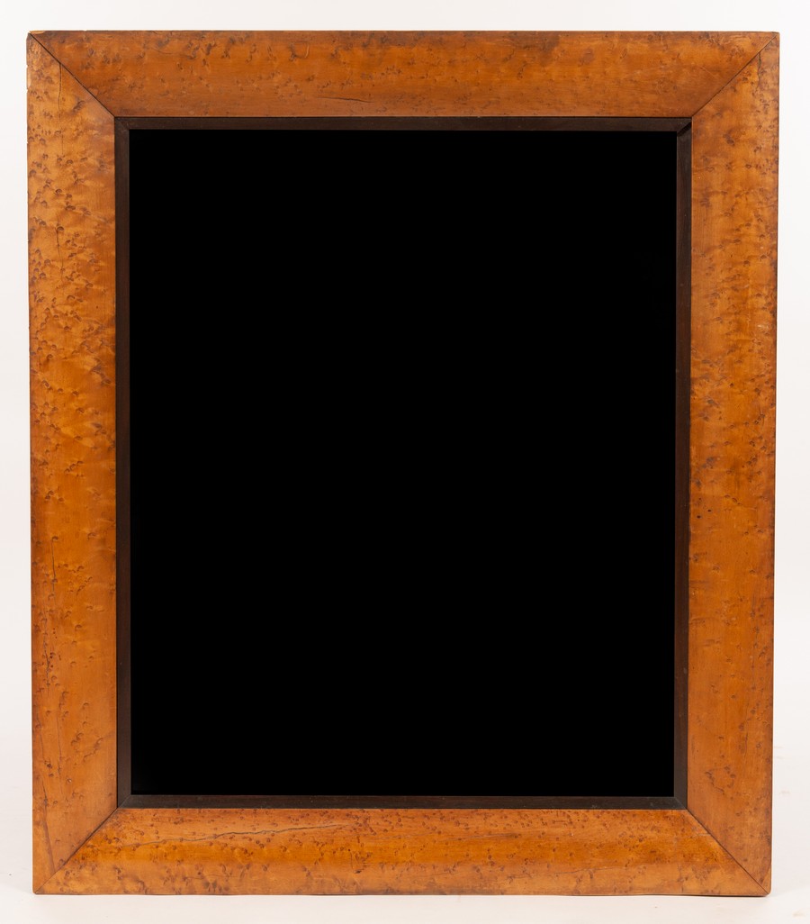 A rectangular wall mirror with bevelled plate in a bird's eye maple frame,