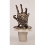 A silver decanter stopper, LCC, London,