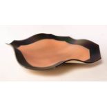 John Dunn (born 1944), a square shaped stoneware charger with canted corners and undulating form,