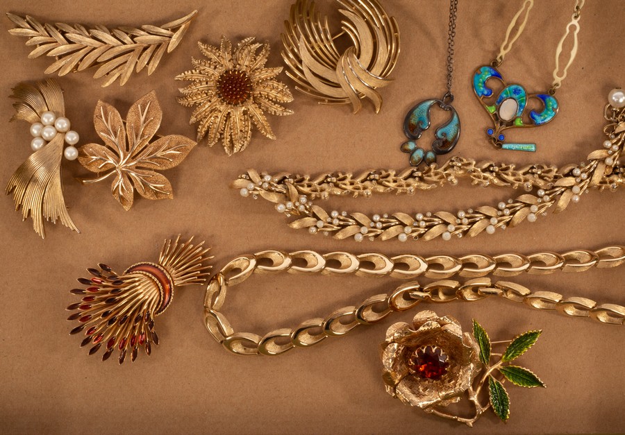 A quantity of costume jewellery by Trifari, comprising six brooches and two necklaces,