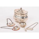 A silver tea caddy, Sheffield 1911, of rounded oblong form, 9cm wide, a caddy spoon,