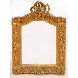 A 19th Century gilt plaster arch top frame with acanthus and C-scroll border and scrolling acanthus
