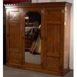 An Aesthetic period pitch pine wardrobe with turret frieze,