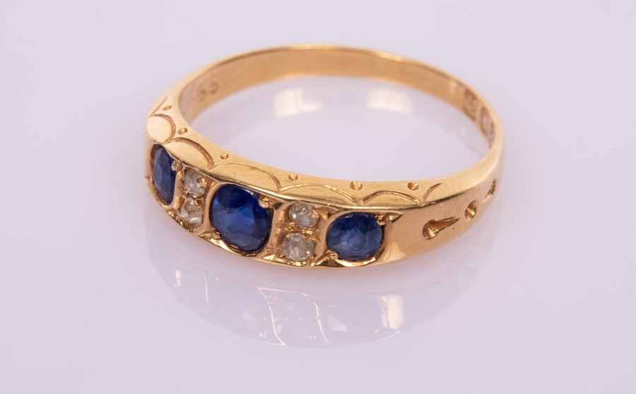 A sapphire and diamond ring in 18ct gold,