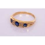 A sapphire and diamond ring in 18ct gold,