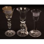 An 18th Century glass with bell-shaped bowl on a double knopped stem set a teardrop,