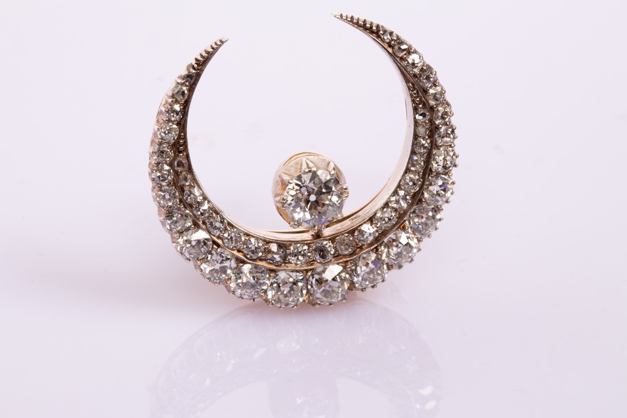 A Victorian diamond crescent brooch, circa 1890,