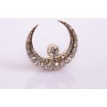 A Victorian diamond crescent brooch, circa 1890,