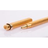 A gold plated pen by Le Must de Cartier, numbered 58289,