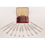 A set of six silver handled dinner knives and six matching dessert knives, Sheffield 1986,