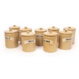 Nine 19cm Bourne Denby creamware storage jars with covers, each with white ribbon names, Starch,