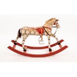 A Stred bow rocker rocking horse with original mane, tail and saddle, later stirrups,