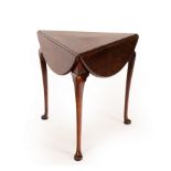 A George II three-legged oak drop leaf table on pad feet, circa 1740,