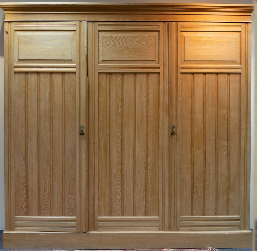 An Arts & Crafts bleached pine triple wardrobe, - Image 2 of 7