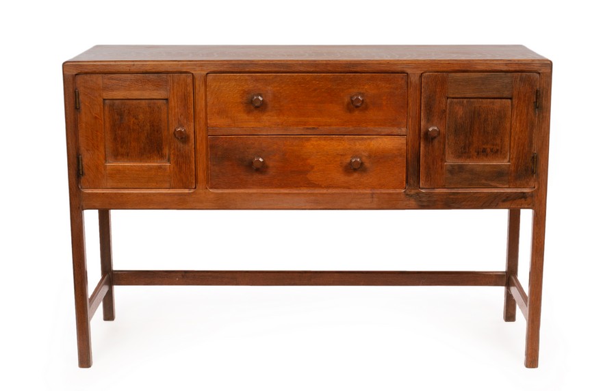 Heal & Son, An Arts & Crafts oak sideboard fitted two drawers flanked by cupboards, 137.