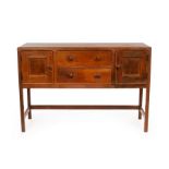 Heal & Son, An Arts & Crafts oak sideboard fitted two drawers flanked by cupboards, 137.