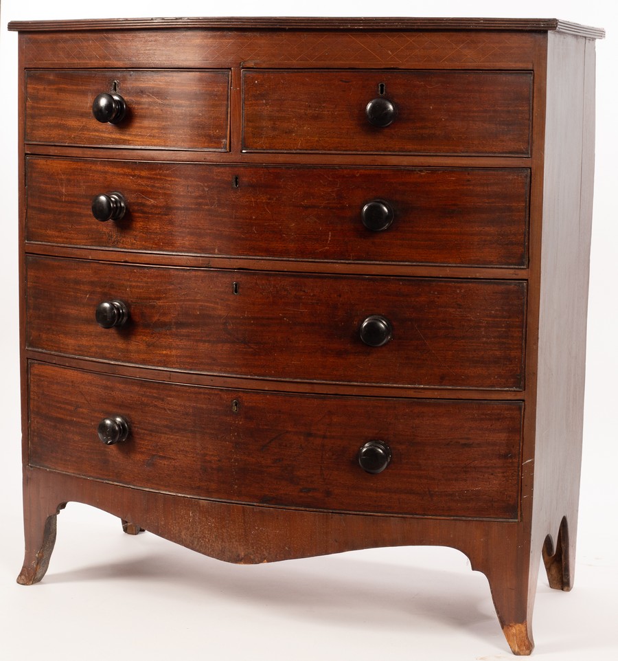 An early 19th Century mahogany bowfront chest of three long and two short drawers, on splay feet,