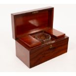 A George III mahogany tea caddy with two compartments and a mixing bowl,