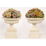 A pair of Continental tin glazed earthenware jardinières of half-fluted oval urn shape,