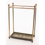 A brass two-division stick stand with turned finials,