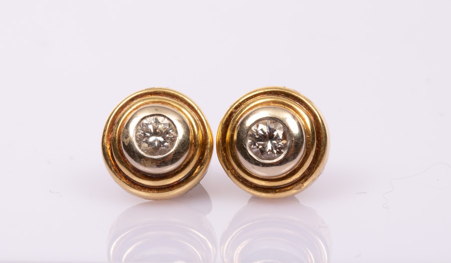 A pair of diamond ear studs each stone of approximately 0.