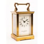 A gilt brass carriage clock by Devon Clocks, the dial signed Charles Frodsham, 15.