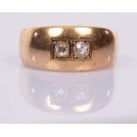 A gentleman's diamond ring, the two diamonds gypsy set in 14ct gold, marked Ela,