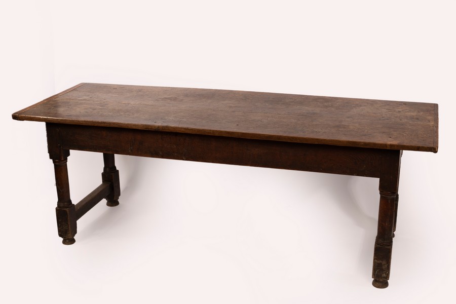An early 18th Century refectory table on turned legs, 218.5cm long, 78.5cm deep, 78cm high.