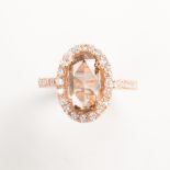 A cognac and colorless diamond and eighteen karat rose gold ring