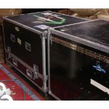 Black enameled instrument gear road tour cases having chrome hardware above a wheeled base