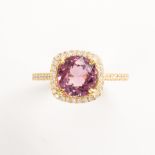 A pink *SPINEL*, diamond and eighteen karat gold ring