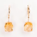 A pair of citrine, diamond and fourteen karat gold earrings