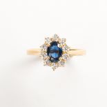 A sapphire, diamond and eighteen karat gold ring