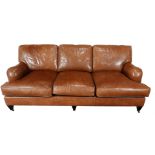 A Coach three seat brown leather sofa